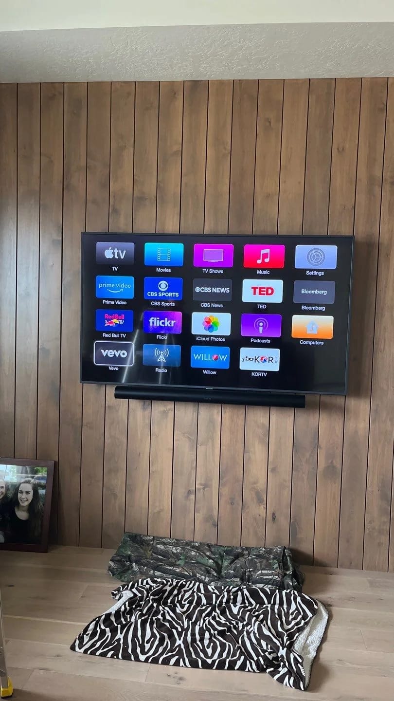 Wall-mounted television and soundbar in the published Middleton audio project